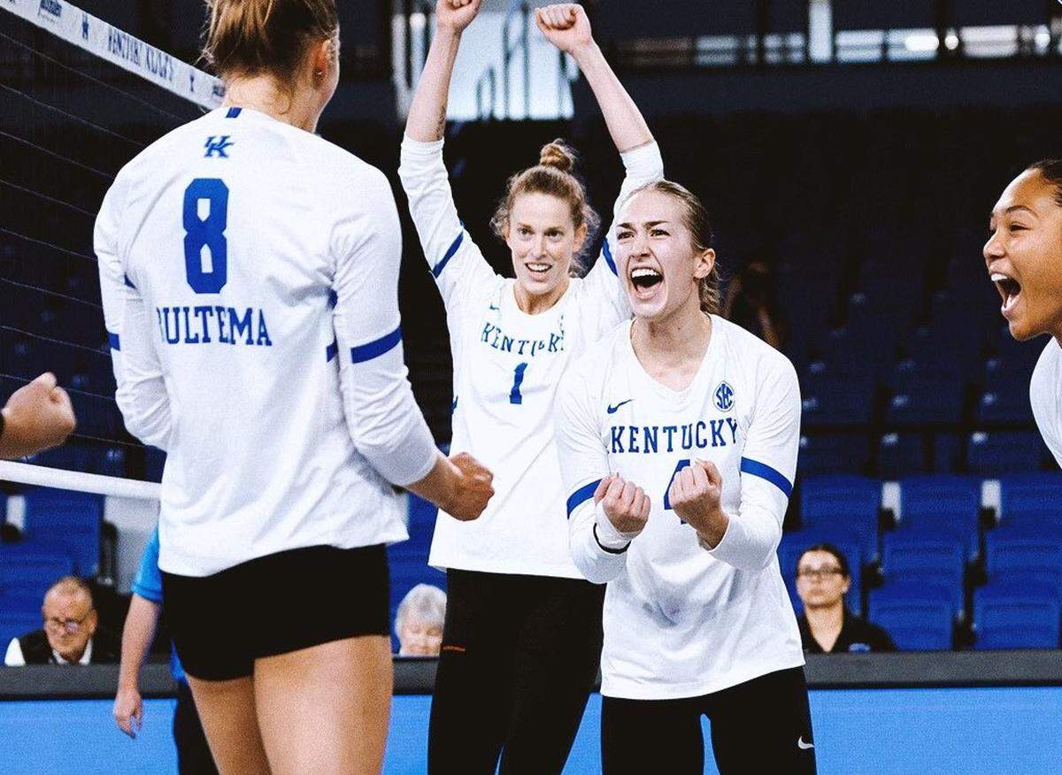 Brooke Bultema (8), Megan Wilson (1), Emma Grome (4) and Asia Thigpen celebrate during Kentucky’s 3-0 sweep of Mississippi State in Memorial Coliseum on Wednesday night.