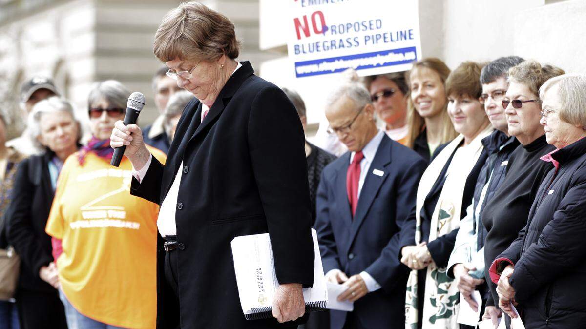Sister Claire McGowan of the Dominican Sisters of Peace held the petition at the Capitol on Monday as she spoke to the media before delivering it to the governor's office.  