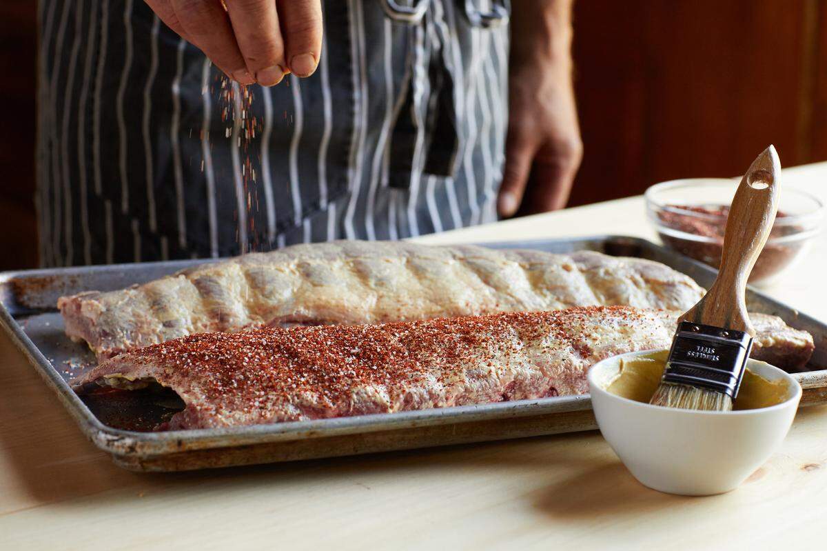 A good rub is one of the secrets to great ribs like these spice-rubbed baby back ribs with chipotle-bourbon barbecue sauce. This rub features chile powder, brown sugar, salt and pepper and celery seed.
