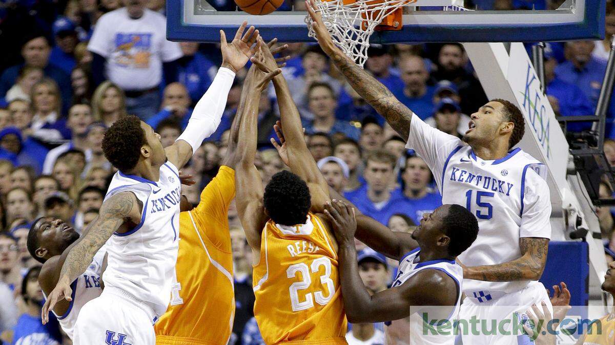Kentucky Wildcats guard/forward James Young (1) and Kentucky Wildcats forward Willie Cauley-Stein (15) battled with Tennessee Volunteers guard Derek Reese (23) for a rebound as #13 Kentucky played Tennessee on Saturday January 18, 2014 in Lexington, Ky.  Photos by Mark Cornelison | Staff