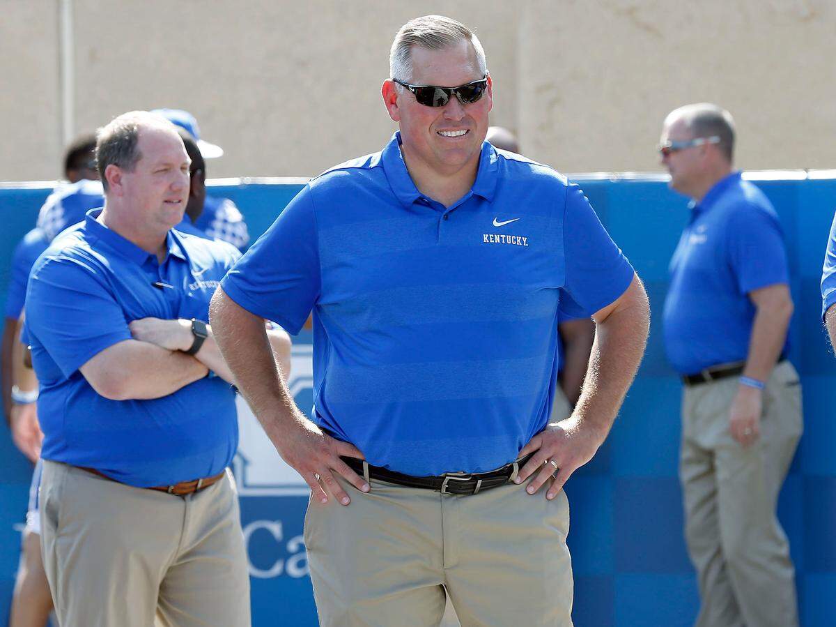 Offensive line coach John Schlarman watched as the UK football team held its annual Media Day on Friday morning at Kroger Field.
