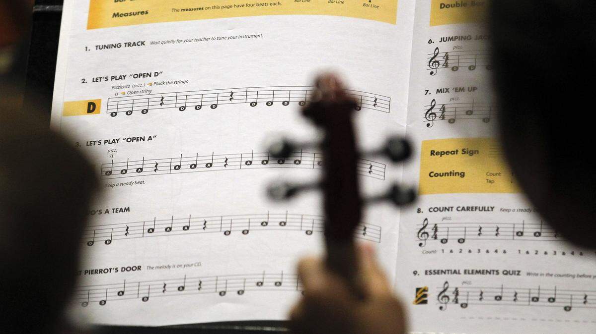 A student studied the music in Rebecca Goff’s beginning 4th grade orchestra class at Rosa Parks Elementary School,1251 Beaumont Centre Lane in Lexington, Ky., Thursday, September 15, 2011. Charles Bertram | Staff