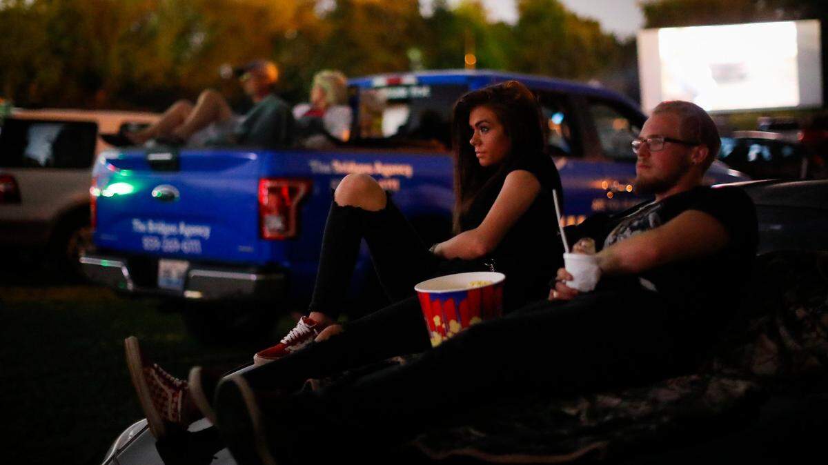 Kenzie Fisher, left, and Harley Baldwin, both of Somerset, Ky., watch Footloose at 27 Twin Drive-In Theatre in Somerset, in this 2020 file photo. The area’s tourism director reports six movies will be filmed in the city this year.