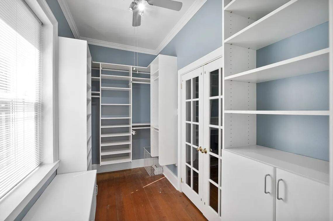A view of the large walk-in closet that adjoins an upstairs bedroom at 315 Heritage Road in Woodford County.