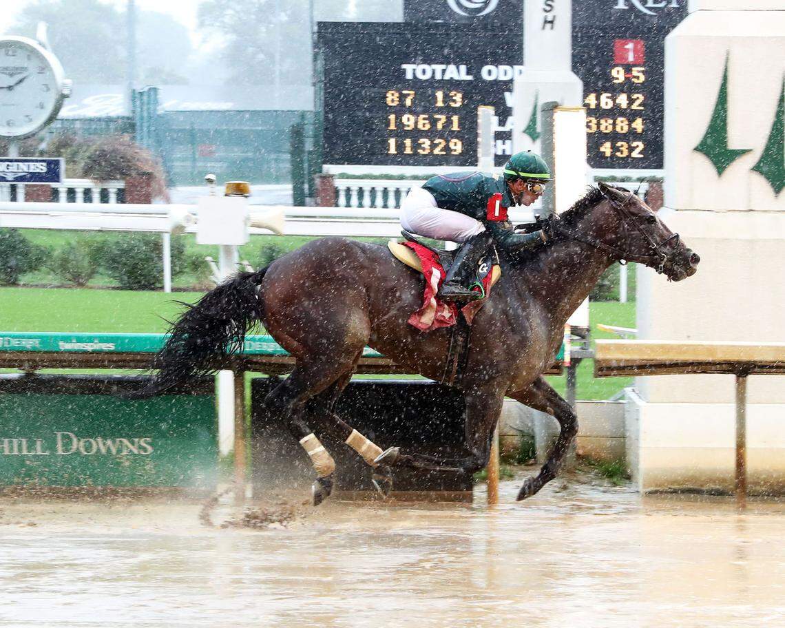 Tyler Gaffalione guides Bango to victory in the third race at Churchill Downs on Friday.