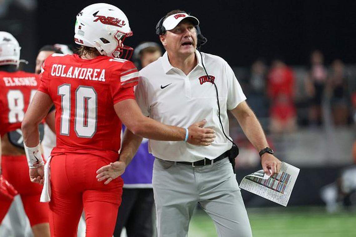 In his first season as UNLV head coach, Dan Mullen, right, has led the Rebels to a 10-2 mark and a berth in the Mountain West Conference championship game.