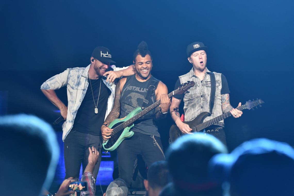 Chase Rice (left) with bassist Marcelo Bakos and guitar player Chris Loocke on the second day of Red, White & Boom 2018, Sept. 1 at Rupp Arena in Lexington, KY.