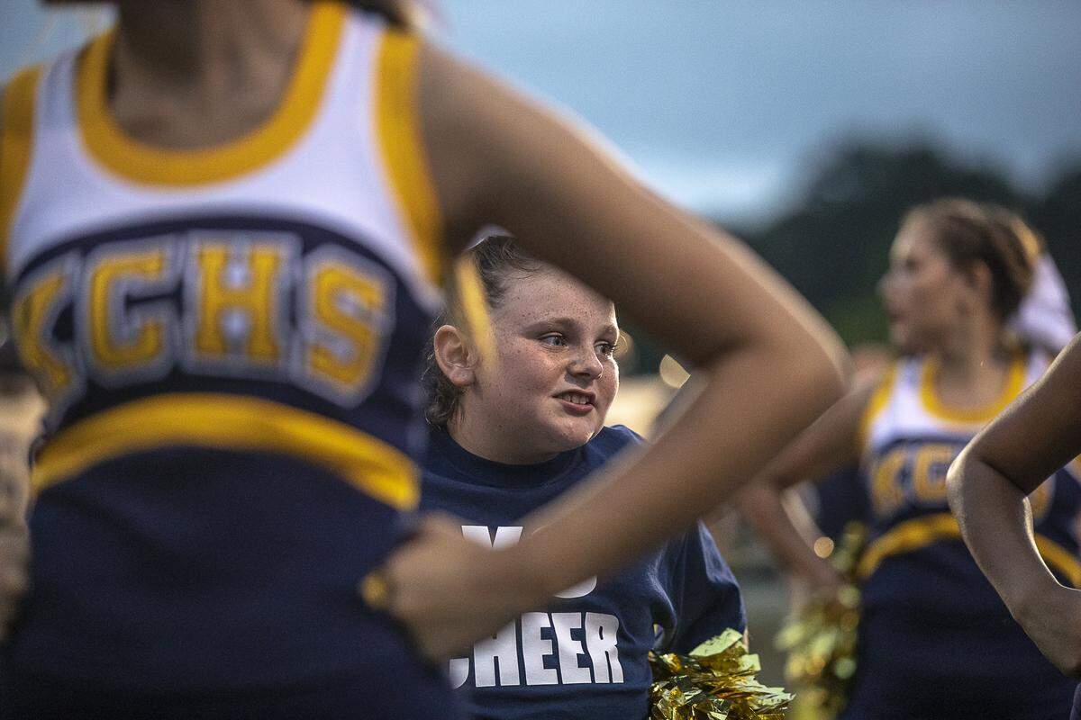 Raegan Jackson, 9, a fourth grader at Jesse D. Lay Elementary School, cheers with the Knox Central High School cheerleaders.