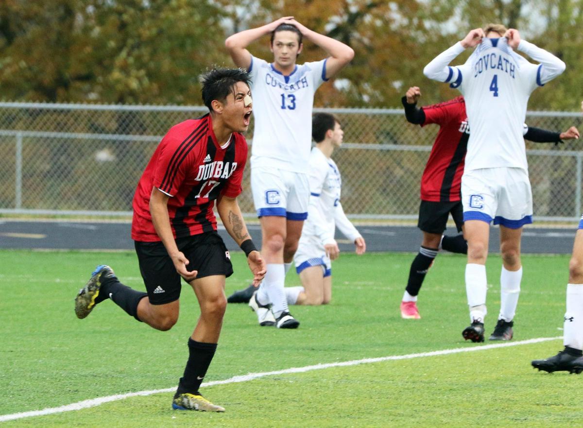 Paul Laurence Dunbar’s Rodrigo Romero (17) celebrates his second-half goal during the KHSAA boys’ state soccer tournament finals against Covington Catholic at Frederick Douglass High School in Lexington on Saturday. Dunbar defeated Covington Catholic 2-1 to win the 2021 state championship.