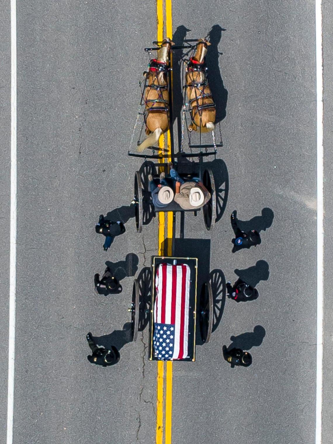 The coffin carrying Jacob Chaffins is brought to Gethsemane Gardens in Prestonsburg, Ky., on Thursday, July 7, 2022. Chaffins, a Prestonsburg police officer, was killed in the line of duty last week.