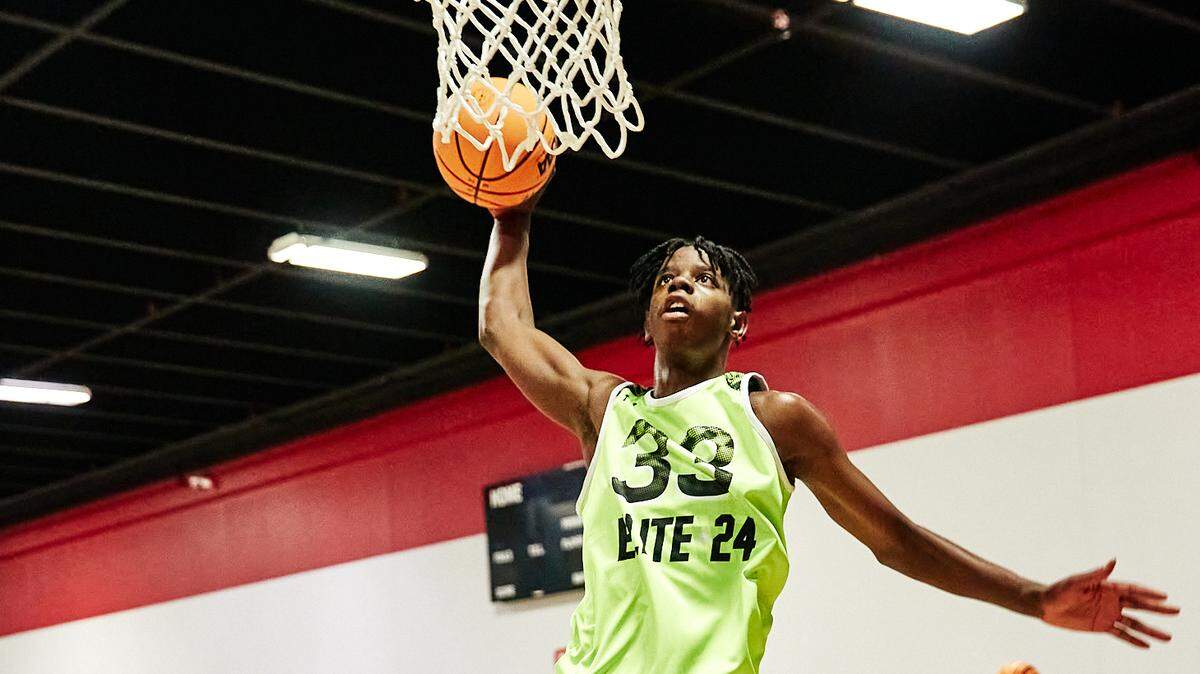Class of 2025 Kentucky men’s basketball recruit Caleb Wilson goes to dunk the ball during the Under Armour Next Elite 24 event in August 2023 at the CORE4 Atlanta facility in Chamblee, Georgia. Wilson said he will be taking an official visit to UK this fall.