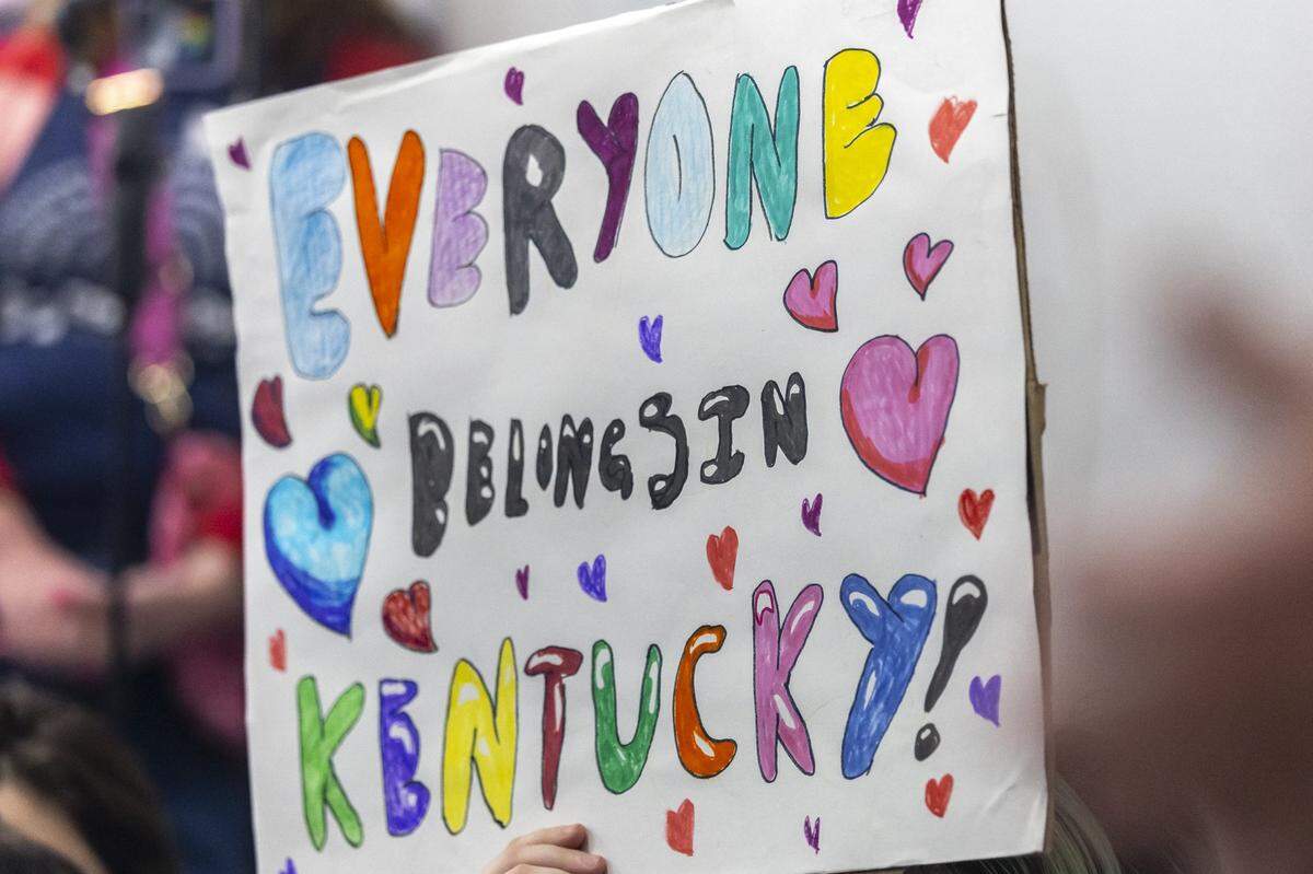 Attendees display signs during the Fairness Rally at the Kentucky state Capitol Education Center in Frankfort, Ky., on Wednesday, Feb. 25, 2026.