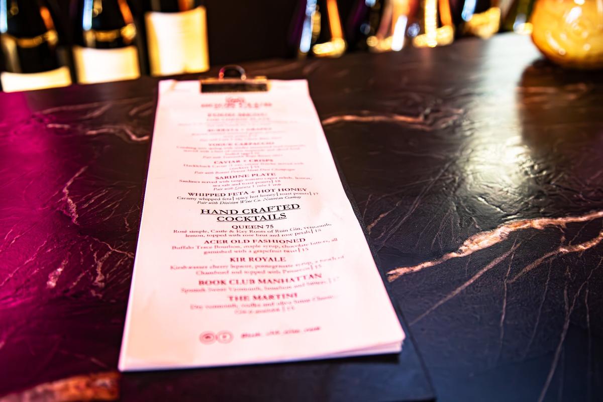 A bar menu featuring handcrafted cocktails at the new speakeasy located inside District 7 Social in Lexington’s Distillery District, called Book Club Wine Room at 1170 Manchester St #160 on May 23, 2025, in Lexington, Ky.