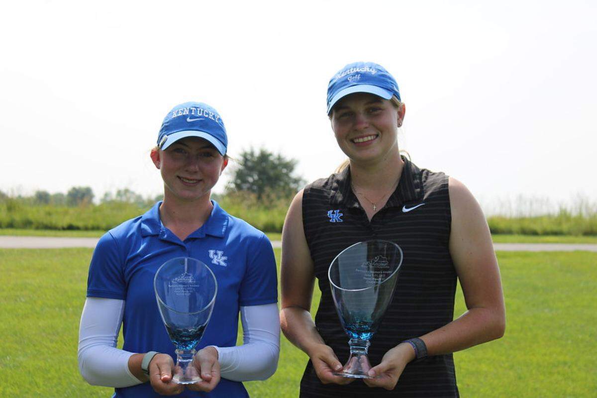 Cathryn Brown, right, and C.A. Carter displayed their hardware after Brown defeated her University of Kentucky teammate to win the 97th Kentucky Women’s Amateur golf championship on Wednesday.