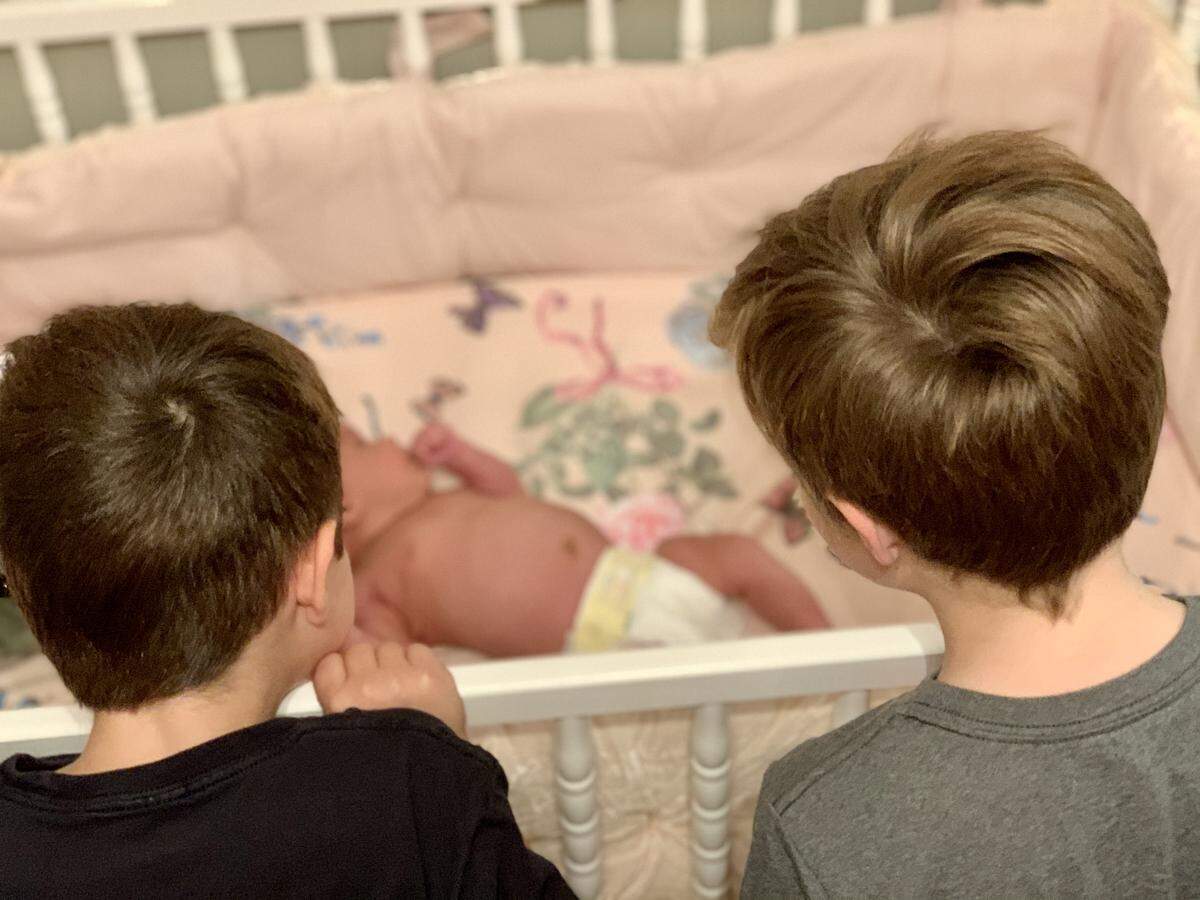 McCoy and Calvin Harvey checked out their new baby sister, Etta Jo.
