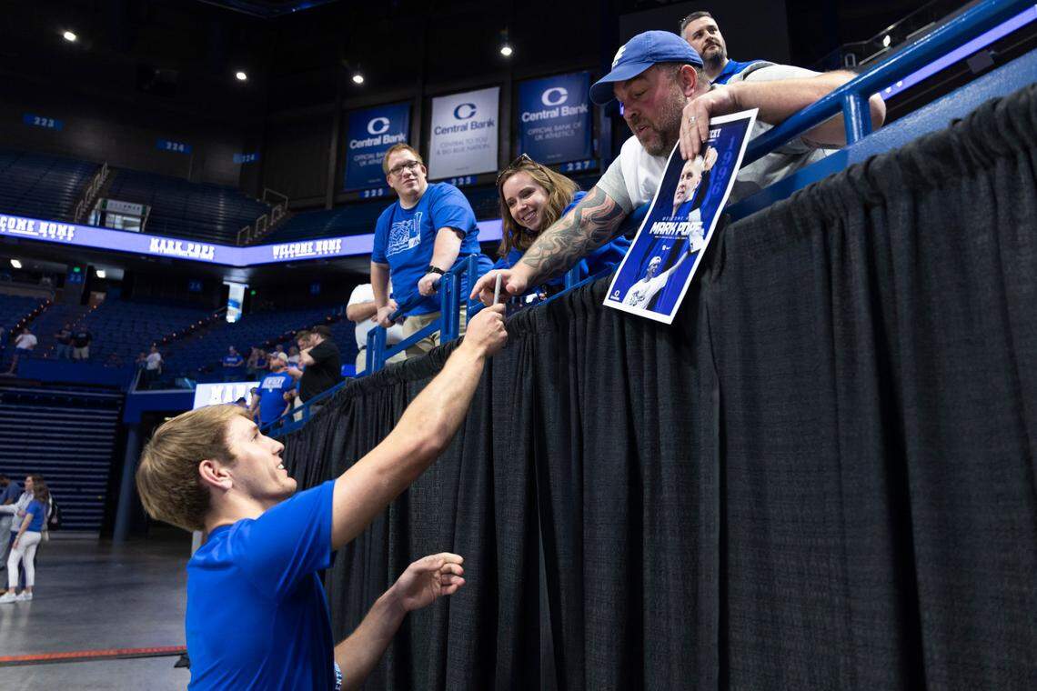 KHSAA Sweet 16 state champion, 2024 Mr. Kentucky Basketball and UK signee Travis Perry signs an autograph for a fan during an introductory event for new Wildcats coach Mark Pope at Rupp Arena in April.