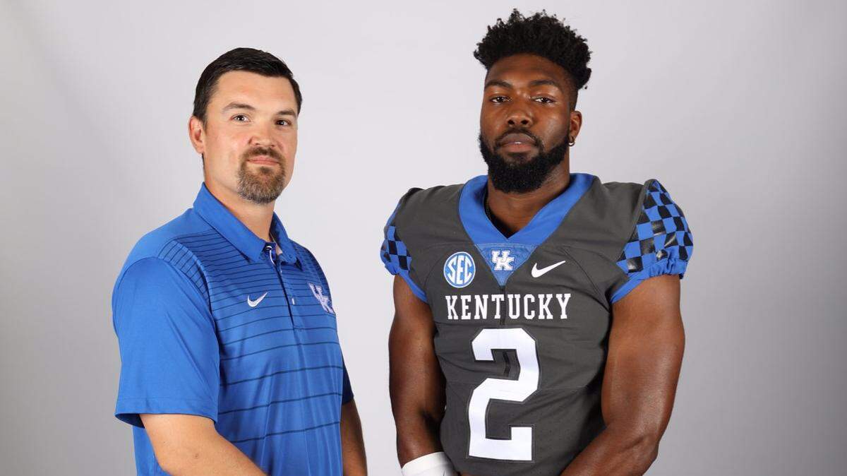 Marquez Bembry, who signed with Tennessee before attending a junior college, is shown on a recruiting visit posing with Kentucky outside linebackers coach Brad White. Bembry committed to Kentucky on Monday.