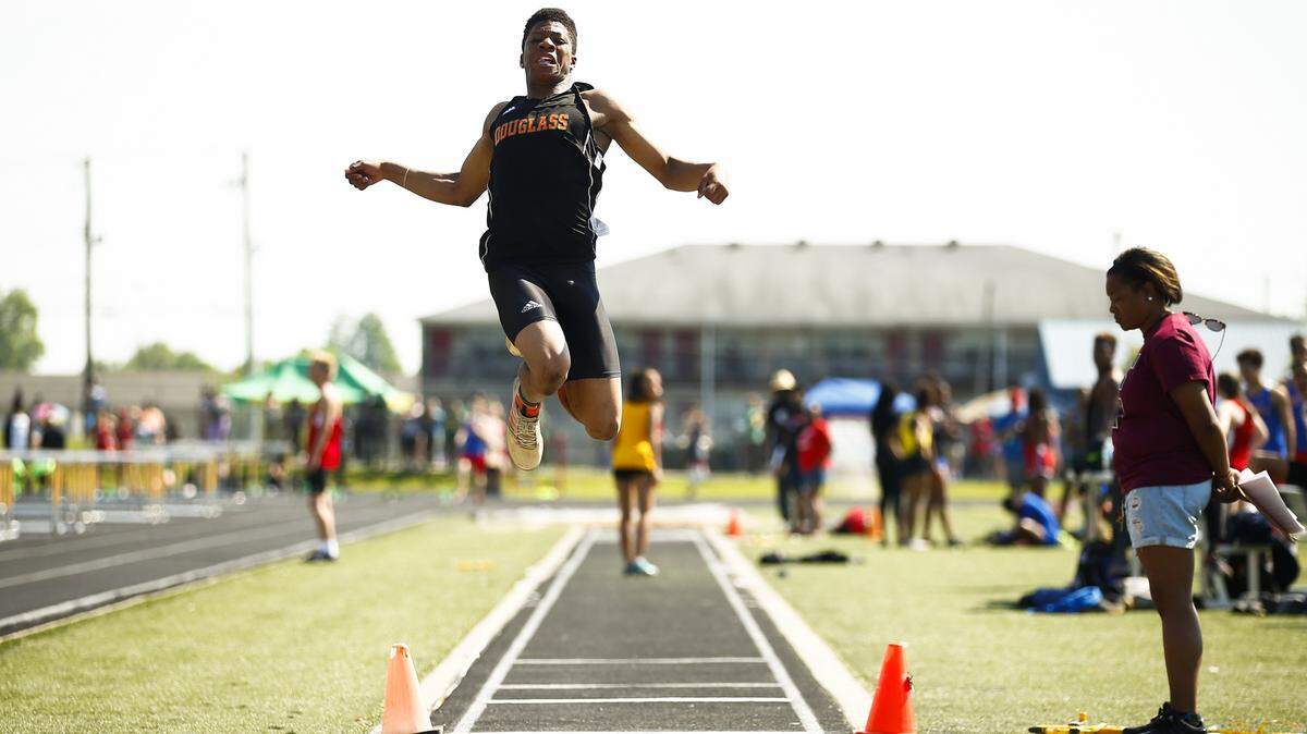 Frederick Douglass' Christian Lewis competed in the boys long jump with a distance of 21 feet and 1/2 inch during the Class 3A, 6th Region track meet Saturday at Henry Clay High School. 