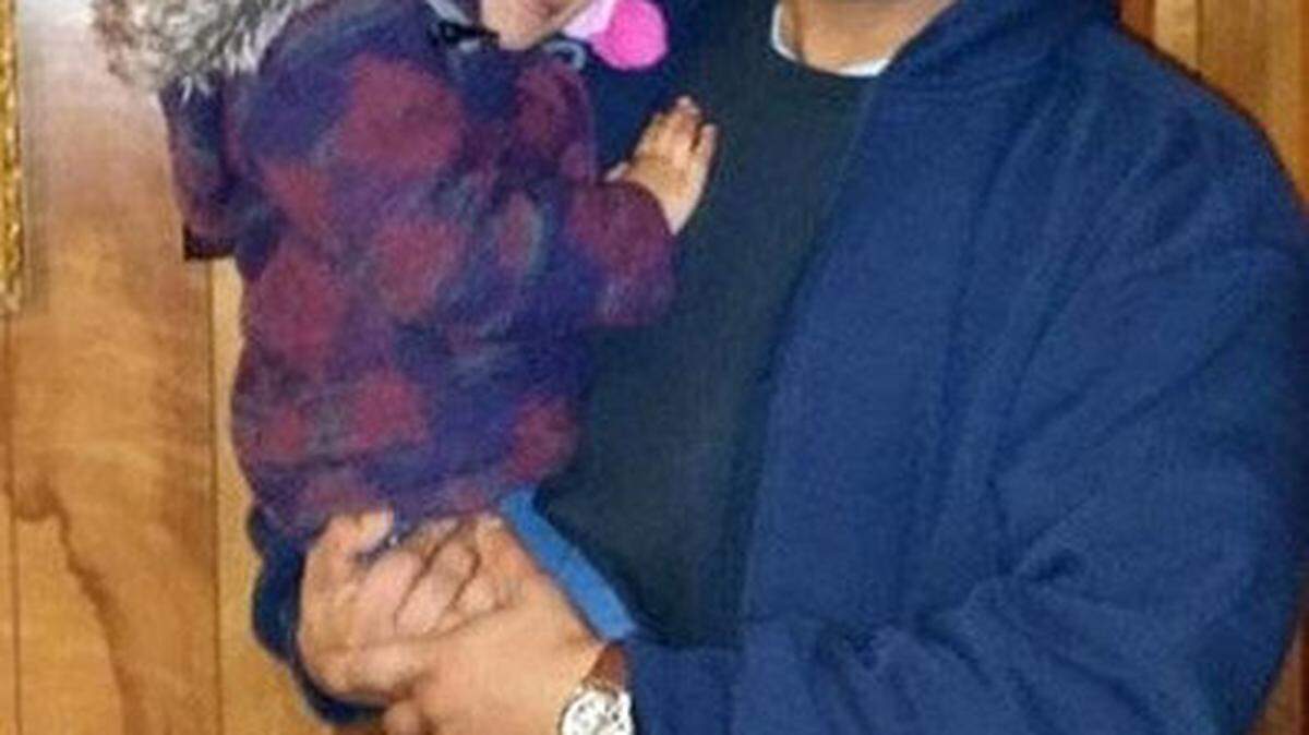 Kwame El-Amin held his 3-year-old daughter Jameelah. The 42-year-old also had two sons.
