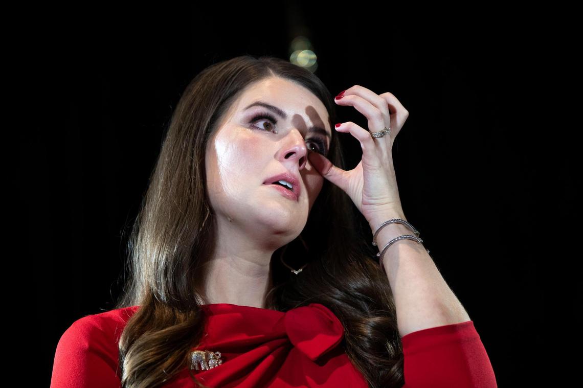 Daniel Cameron’s wife, Makenze Cameron, wipes away tears as her husband gives his concession speech during an election event at the Louisville Marriott in Louisville, Ky, Tuesday, November 7, 2023.