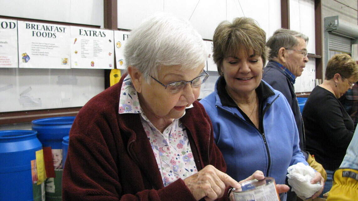 Volunteers from St. Luke gather weekly to organize, box donations to God's Pantry