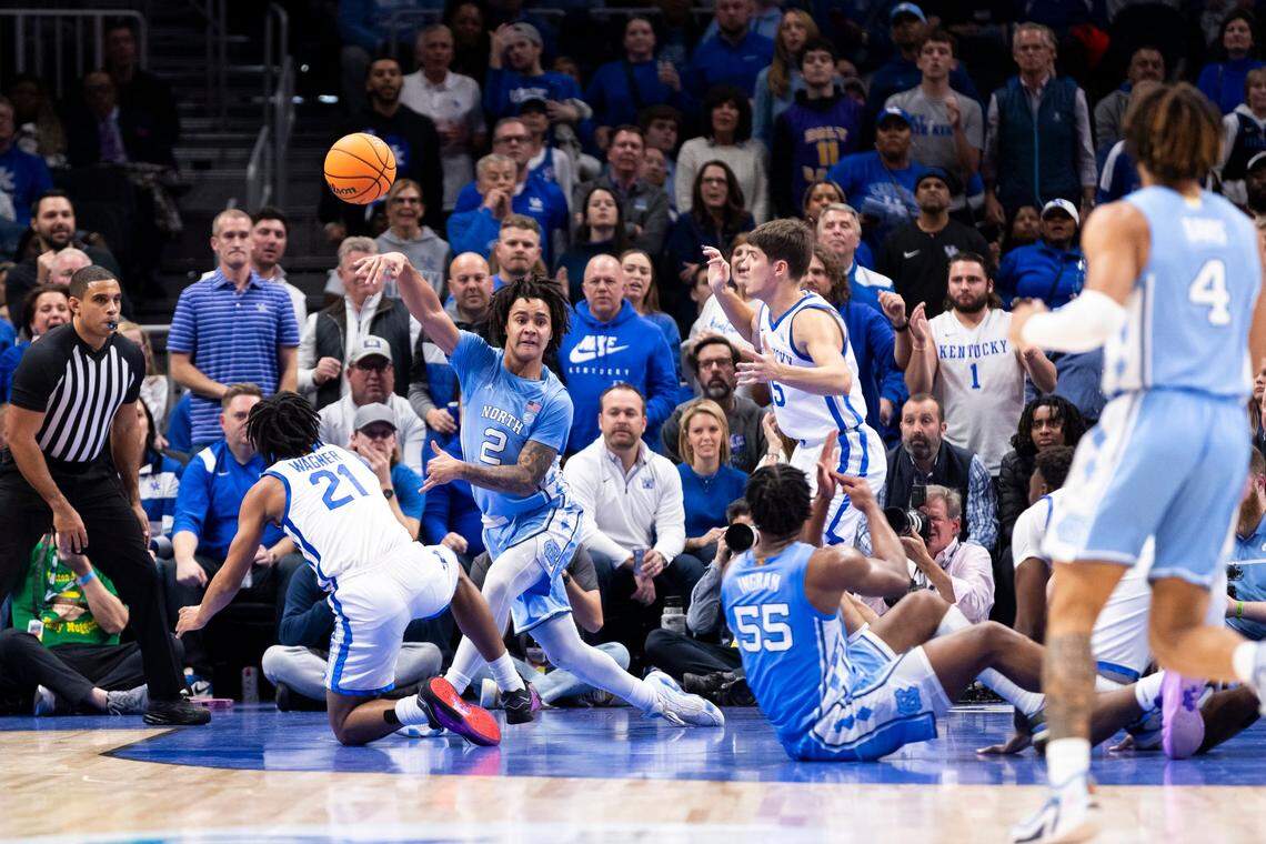 North Carolina guard Elliot Cadeau (2) recovers a loose ball from the Kentucky Wildcats during the the CBS Sports Classic at State Farm Arena in Atlanta on Saturday.