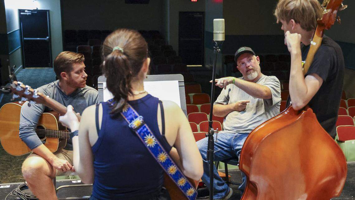 Bluegrass University teachers Jayd Raines, right facing camera, and Zac Combs, give instructions to Ian Slucher, far right, and Sylvie Coogle, Monday, Sept. 15, at the Leeds Center For The Arts, Monday, Sept. 15, in Winchester, Ky. The launch of Bluegrass University coincides with a resurgence in bluegrass music's popularity, highlighted by artists like Billy Strings and the Grammy Hall of Fame induction of J.D. Crowe & The New South, underscoring the genre's global appeal while maintaining its Kentucky roots.