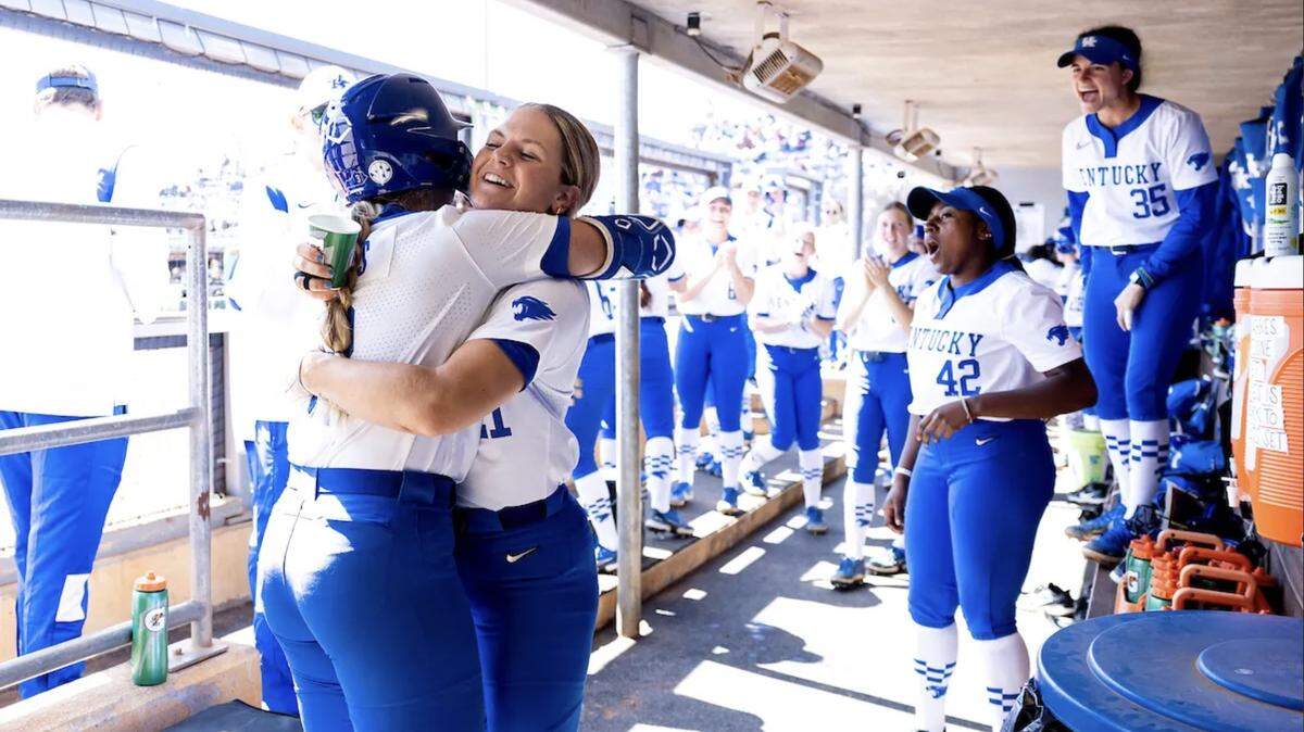 Taylor Ebbs and Erin Coffel celebrate during the Wildcats’ win over Texas A&M on Sunday.