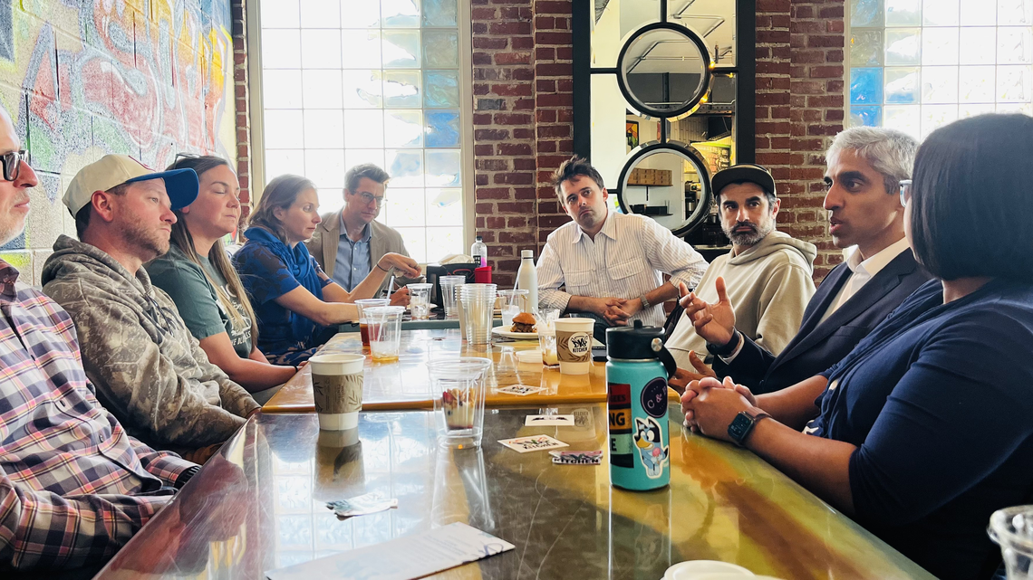 Former U.S. Surgeon General Vivek Murthy meets with several Lexington local business owners.