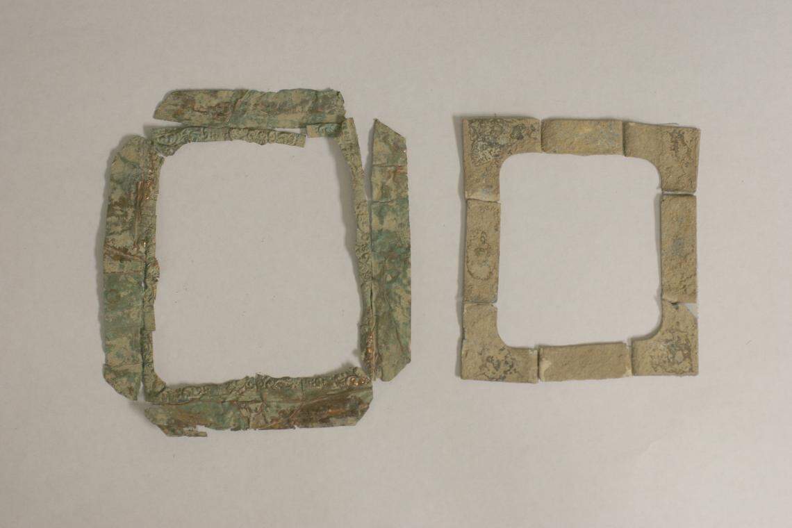 Photographic artifacts, including a brass photograph preserver, left, and a brass photograph mat, right, were found at the Berkley store site, where archaeologists discovered a photo studio.