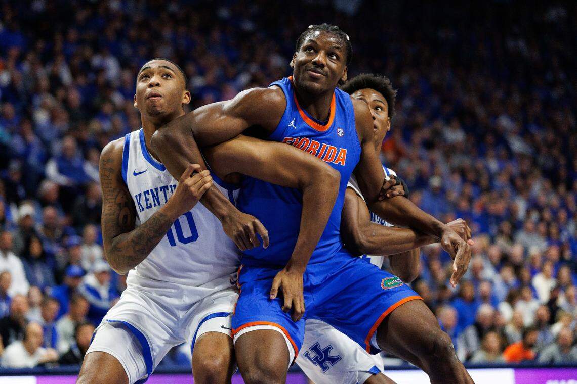 Jan 4, 2025; Lexington, Kentucky, USA; Florida Gators center Rueben Chinyelu (9), Kentucky Wildcats forward Brandon Garrison (10) and guard Jaxson Robinson (2) jostle for position during the first half at Rupp Arena at Central Bank Center. Mandatory Credit: Jordan Prather-Imagn Images