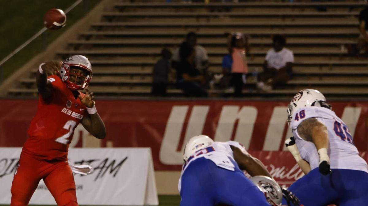 Former University of Kentucky quarterback Terry Wilson (2) completed his first 11 passes as a New Mexico Lobo on Thursday night and finished 20-for-26 overall with three touchdowns in a 27-17 season-opening victory over Houston Baptist.