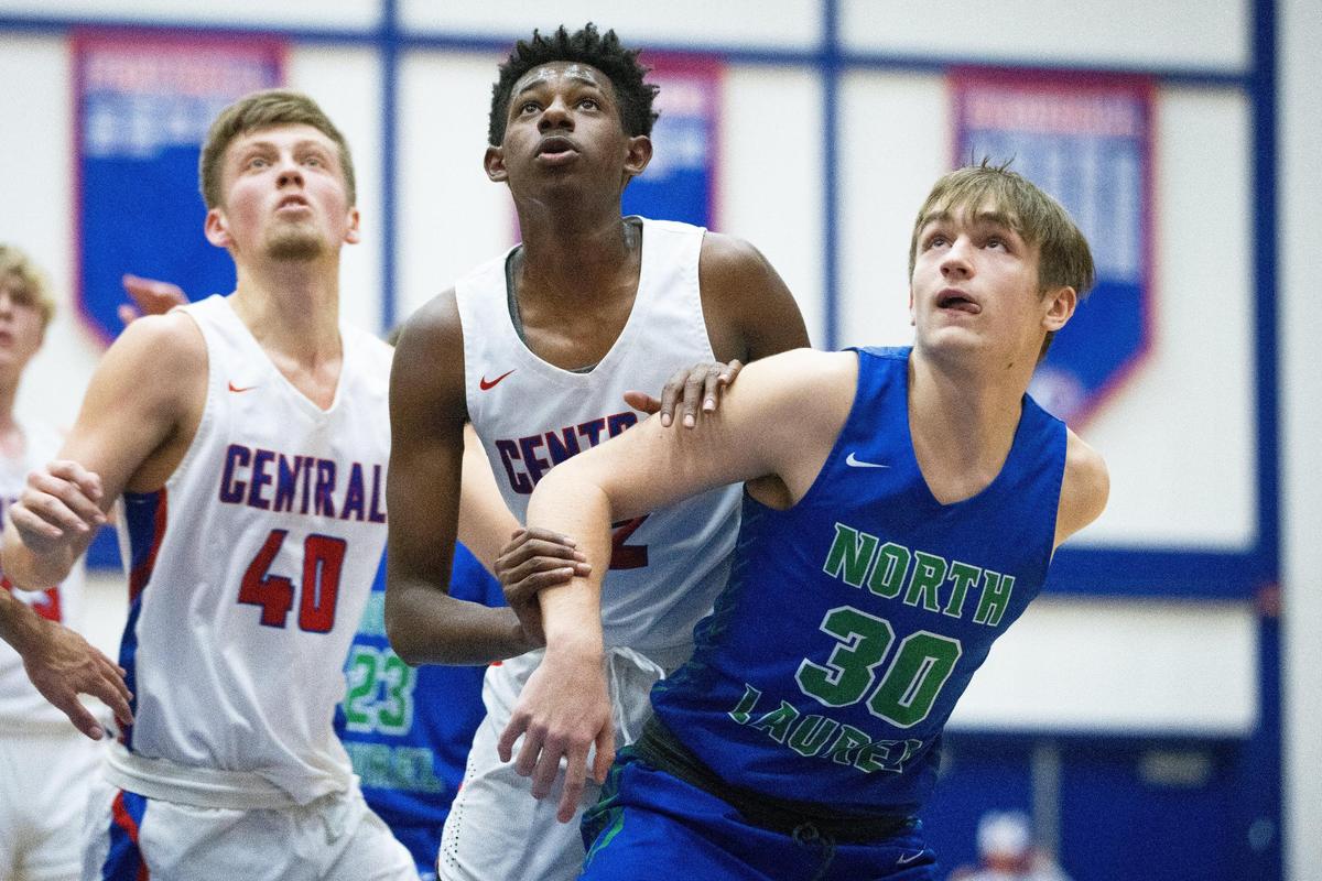 North Laurel’s Cole Messer (30) boxed out Madison Central’s Jayken Davis (12) during Tuesday night’s game in Richmond.