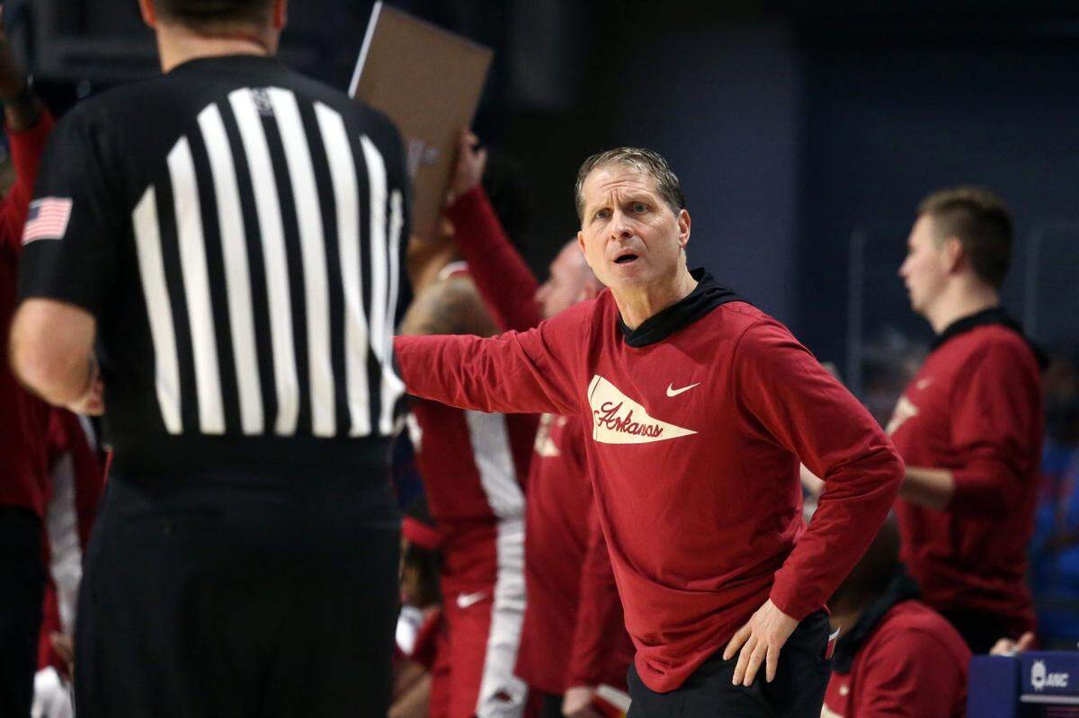Arkansas Razorbacks head coach Eric Musselman, right, reacts to an official during the first half against his team’s 77-51 loss to the Mississippi Rebels at The Sandy and John Black Pavilion at Ole Miss on Wednesday.