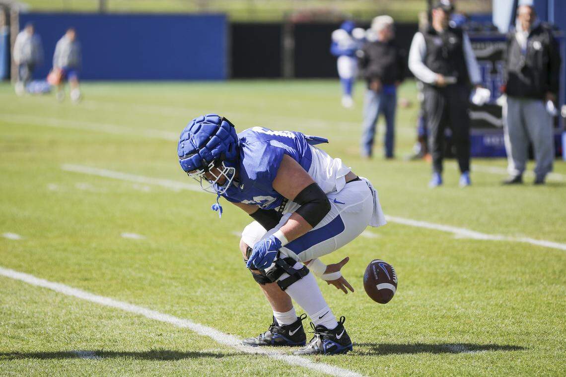 After Kentucky football practices, Mark Stoops says he often looks down from his office and sees Jager Burton practicing shotgun snaps. Burton, the former Fredrick Douglass High School star, is seeking to transition from guard to center for UK in 2025. In 2023, Burton started the first three games for the Wildcats at center but was then shifted back to guard.