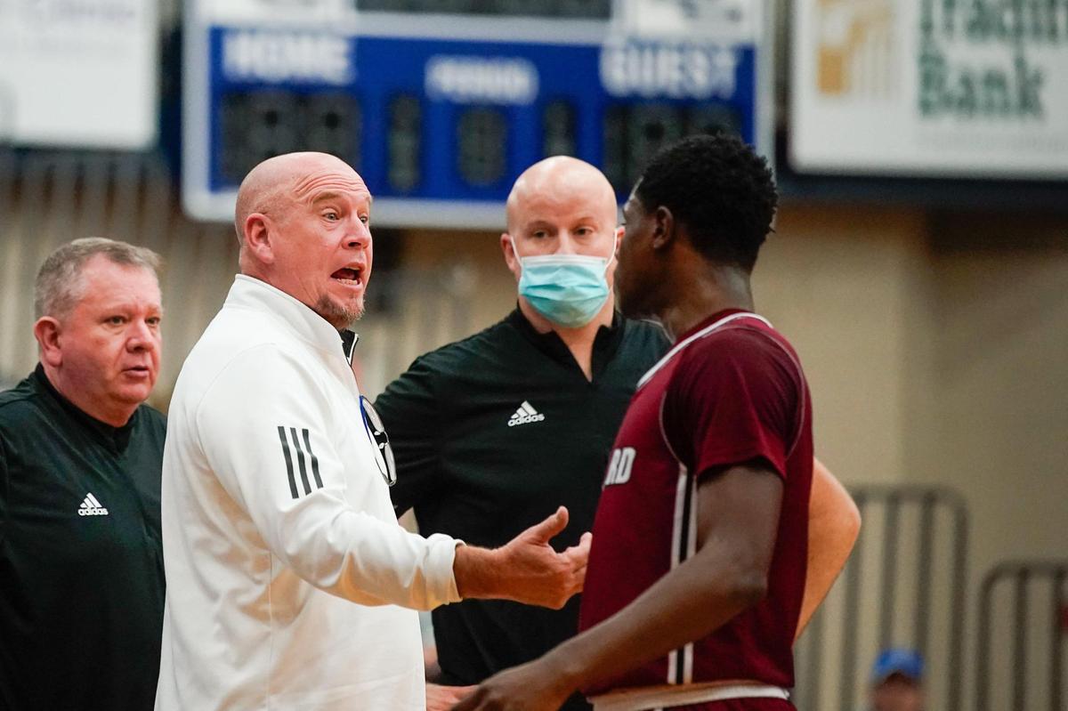 Ballard head coach Chris Renner talks to Kaden Stanton during the Bruins’ 74-65 win over Lexington Catholic in the White, Greer and Maggard Holiday Classic semifinals on Tuesday night. Top-ranked Ballard was defeated by Clark County in Wednesday’s finals.