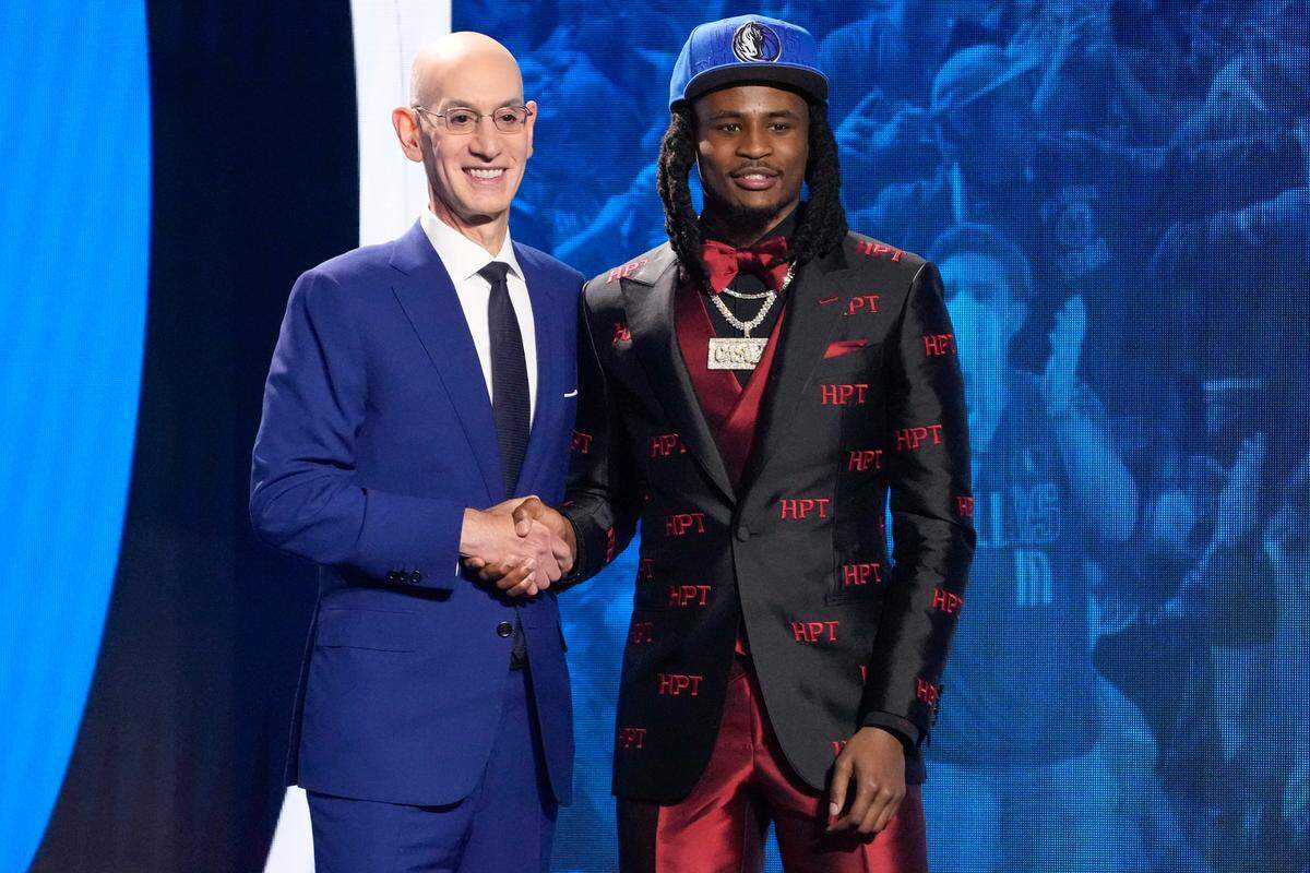 Cason Wallace poses for a photo with NBA Commissioner Adam Silver after being selected 10th overall by the Dallas Mavericks during the NBA Draft. He was traded to the Oklahoma City Thunder.
