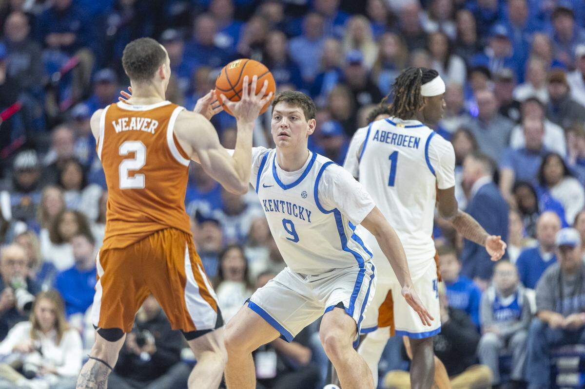 Kentucky basketball forward Trent Noah (9) defends Texas guard Chendall Weaver (2) during a game at Rupp Arena in Lexington, Ky., on Wednesday, Jan. 21, 2026.  