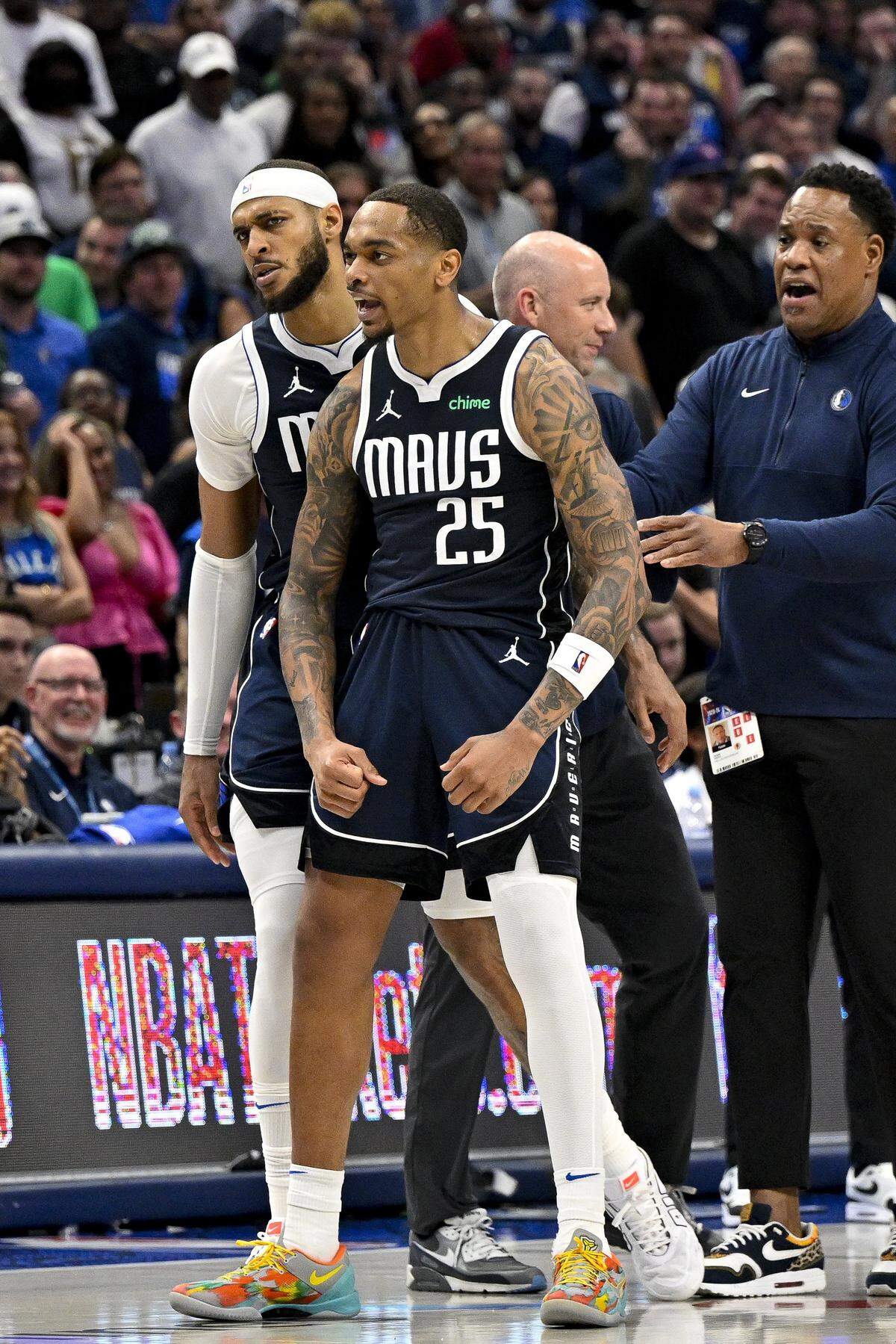 Apr 26, 2024; Dallas, Texas, USA; Dallas Mavericks forward P.J. Washington (25) and center Daniel Gafford (21) come off the court during the fourth quarter against the LA Clippers during game three of the first round for the 2024 NBA playoffs at the American Airlines Center. Mandatory Credit: Jerome Miron-USA TODAY Sports