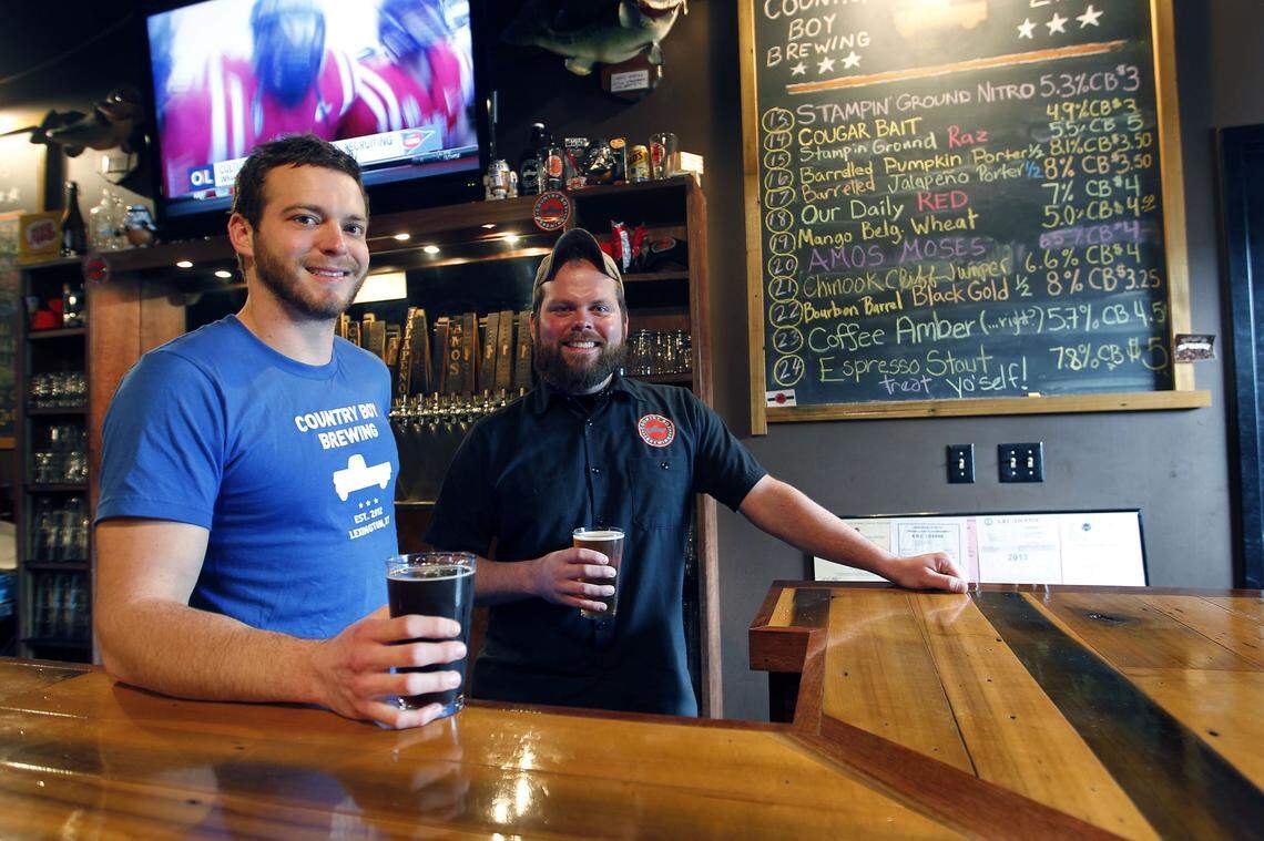 Two of the co-owners, Evan Coppage, left, and Daniel “DH”  Harrison, right, in the taproom at Country Boy Brewing, 436 Chair  Ave. in Lexington, Ky., Tuesday, February 05, 2013. A new apartment complex has been proposed for Chair Avenue that would go where the original Country Boy taproom is now.