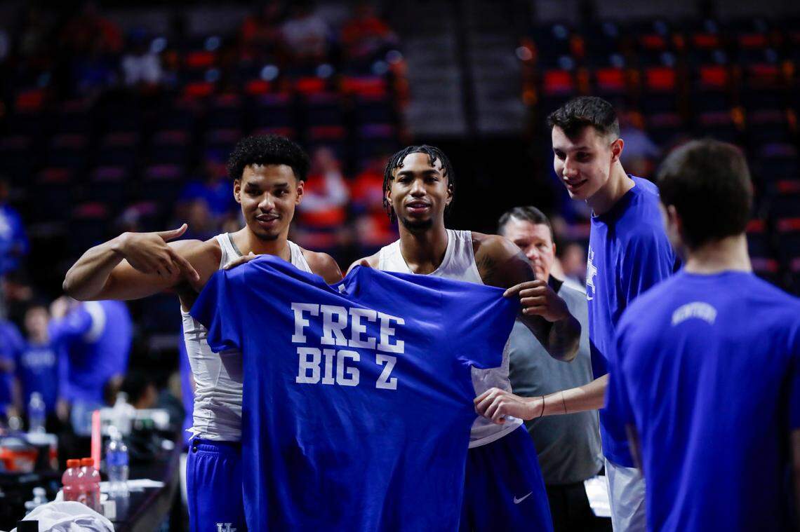 Kentucky men’s basketball players Tre Mitchell, Jordan Burks and Zvonimir Ivisic pose with a shirt that says “FREE BIG Z” prior to UK’s game at Florida on Saturday. Ivisic has yet to be cleared by the NCAA to play this season.