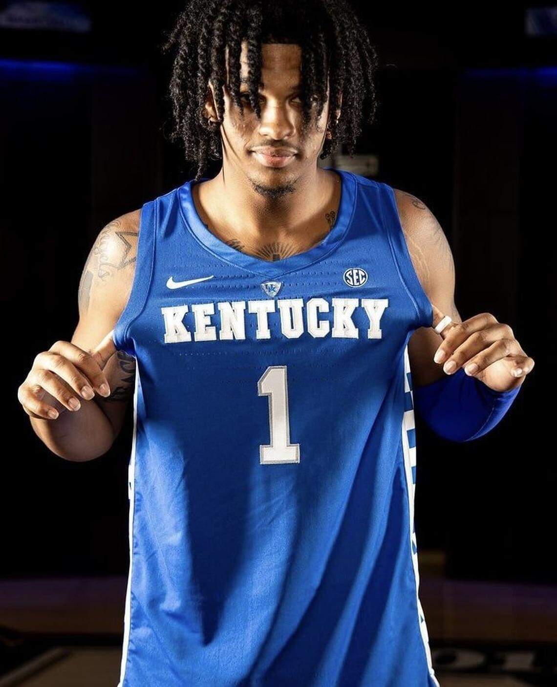 Skyy Clark posed in a UK basketball uniform during an official visit he took to Kentucky as a college basketball recruit. Clark committed to Kentucky in October 2020, but decommitted from the Wildcats in March 2022.
