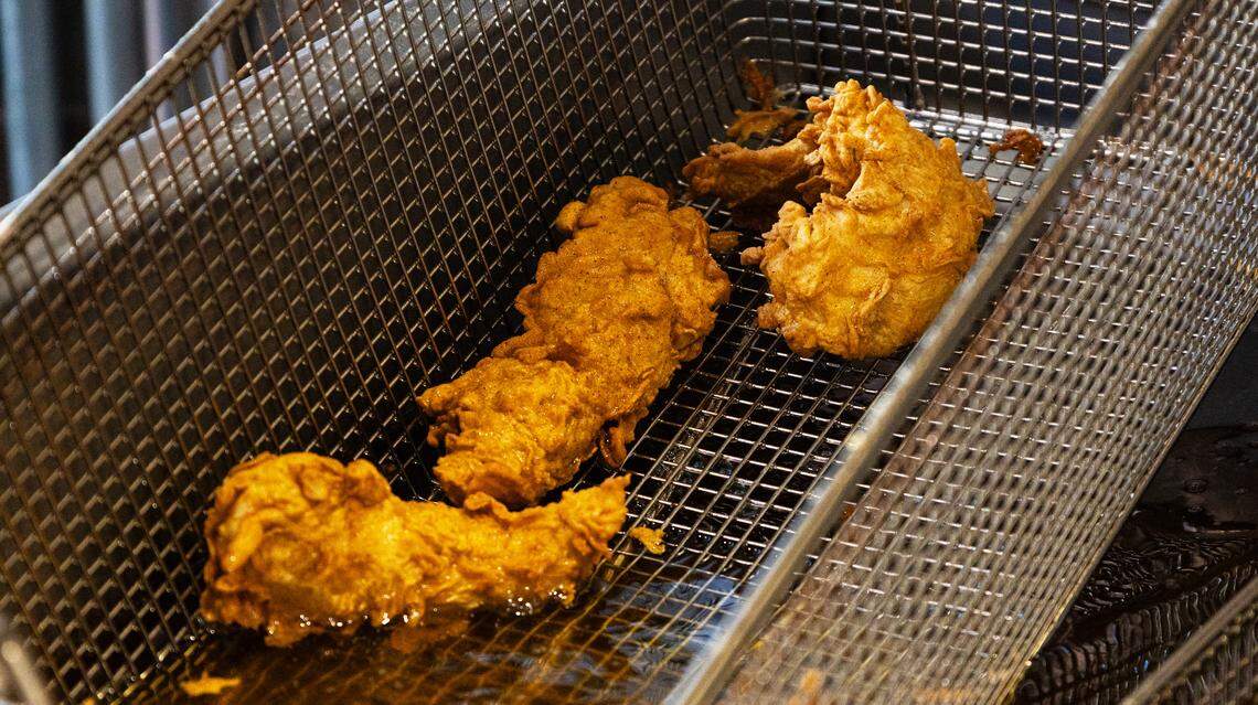 Golden chicken tenders, fresh out of the fryer, serve as the base for such customer favorites as the hot honey sandwich combo and the 3-piece tender meal at Birdies Chicken in downtown Lexington, Ky., on April 21, 2026.