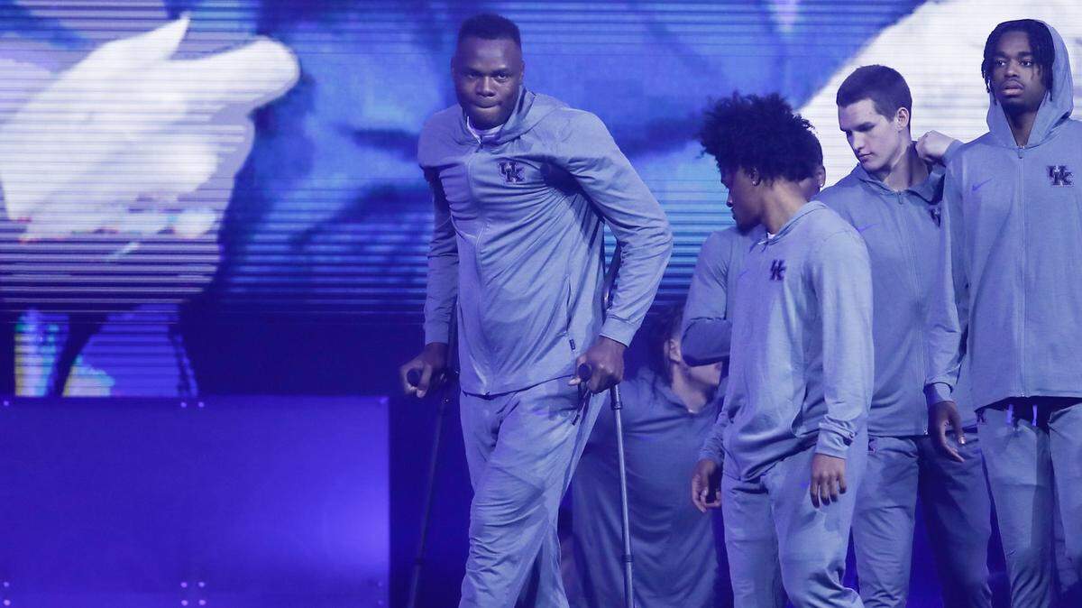 Oscar Tshiebwe was walking with the aid of crutches at Big Blue Madness on Friday night.