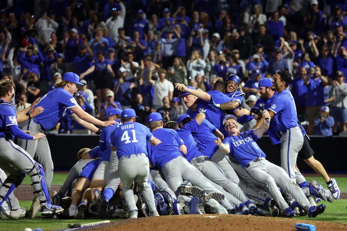 Kentucky players celebrate reaching the College World Series after their defeat of Oregon State on Sunday night at Kentucky Proud Park.