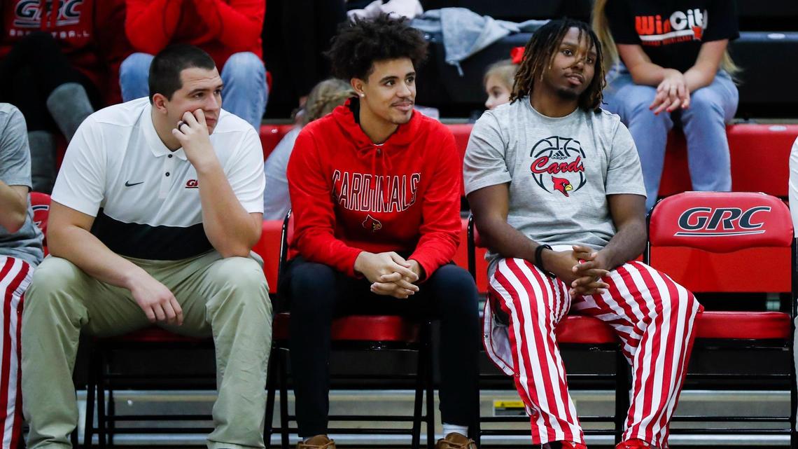 George Rogers Clark guard Tyleik Maxwell, middle, watches Thursday night’s game against Great Crossing from the sideline while recovering from an appendectomy. He expects to be back in uniform soon.