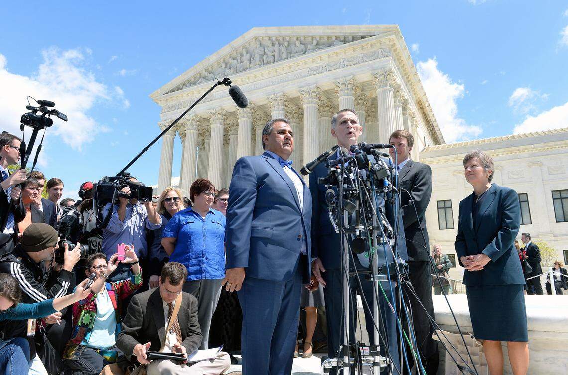 WASHINGTON, DC - APRIL 28: Plaintiffs Michael DeLeon (L) and Gregory Bourke (R) in the Obergefell v. Hodges case speak outside the US Supreme Court on April 28, 2015 in Washington, DC. The Supreme Court meets to hear arguments whether same-sex couples have a constitutional right to wed in the United States, with a final decision expected in June. (Photo by Olivier Douliery/Getty Images)