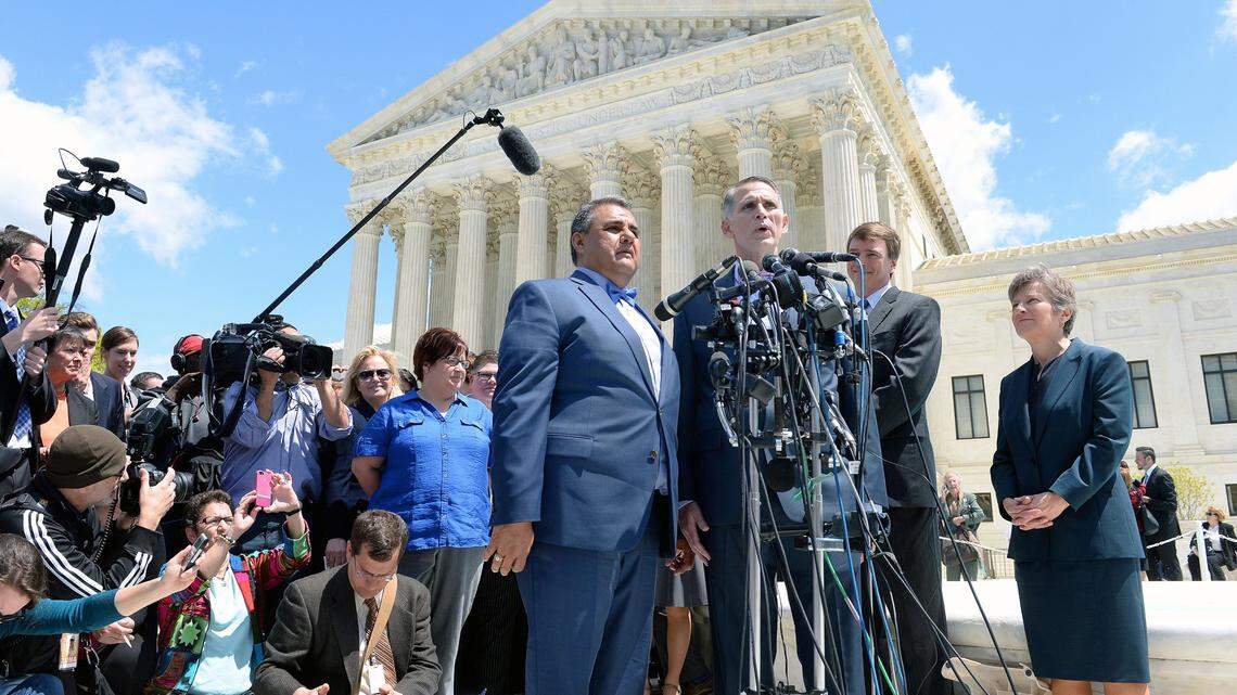 WASHINGTON, DC - APRIL 28: Plaintiffs Michael DeLeon (L) and Gregory Bourke (R) in the Obergefell v. Hodges case speak outside the US Supreme Court on April 28, 2015 in Washington, DC. The Supreme Court meets to hear arguments whether same-sex couples have a constitutional right to wed in the United States, with a final decision expected in June. (Photo by Olivier Douliery/Getty Images)