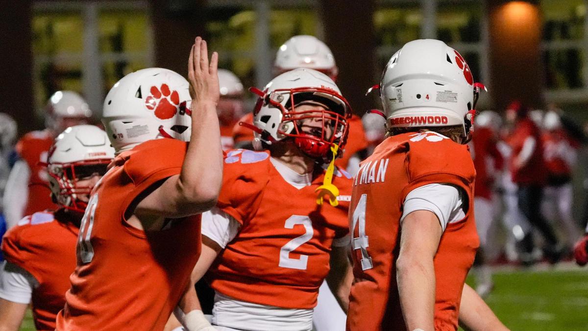 Beechwood senior Luke Erdman (2) celebrates a touchdown against Lexington Christian Academy in Fort Mitchell on Friday night. Beechwood will play Owensboro Catholic in the Class 2A state championship game.