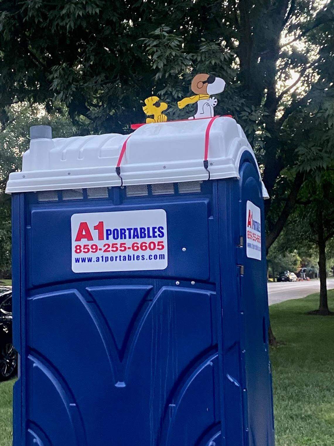 Snoopy and Woodstock flew above the portable toilet since late last summer. Now they’ve disappeared and the homeowners would like them to come home.